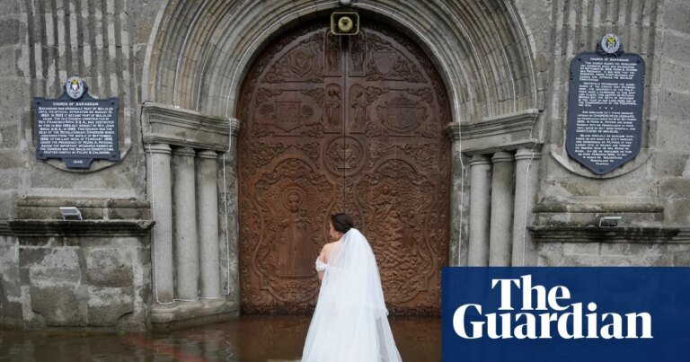 A bride wades through a flood to get married: aaron favila’s best photograph | photography